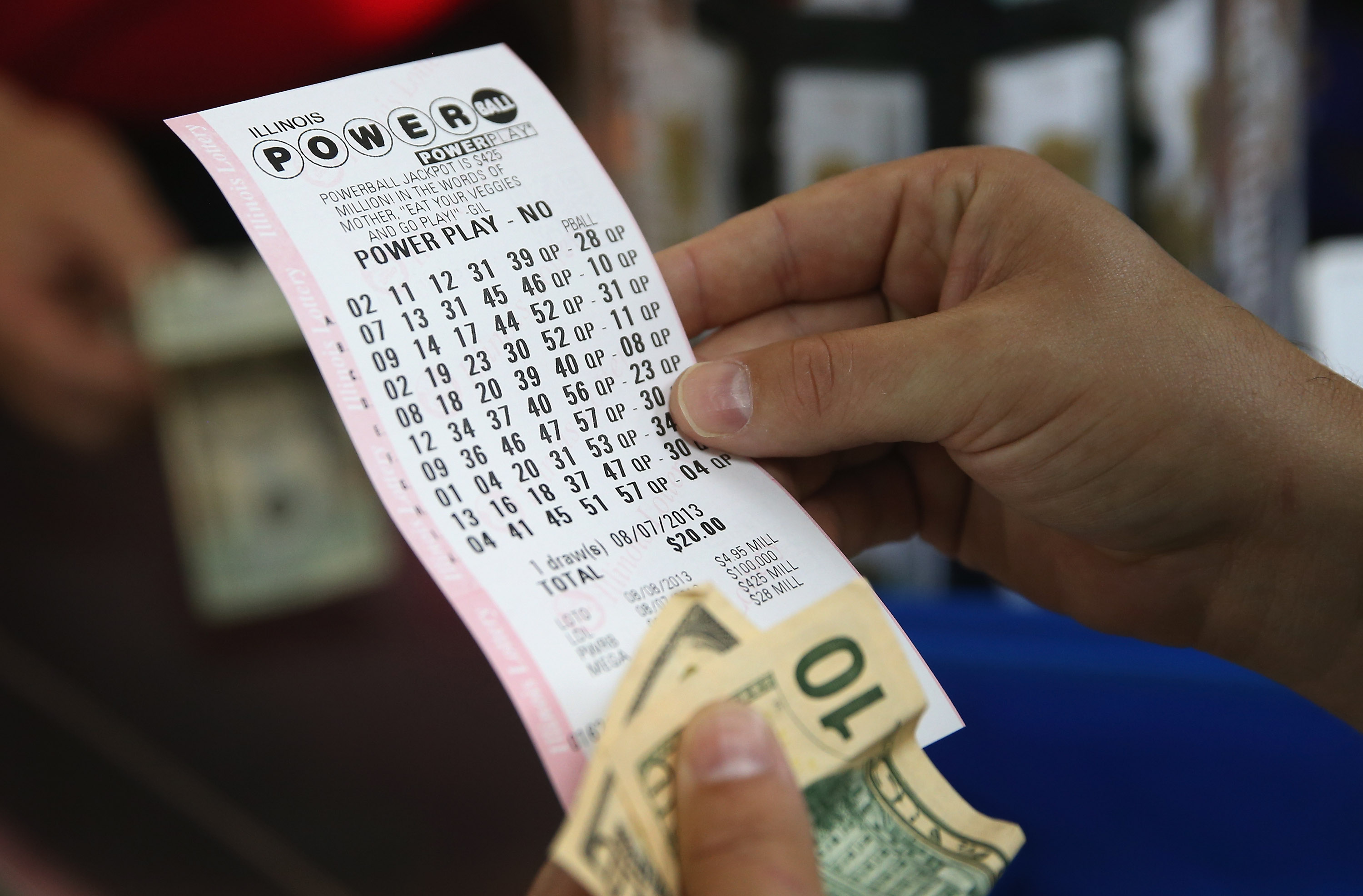 customer-looks-powerball-ticket.jpg